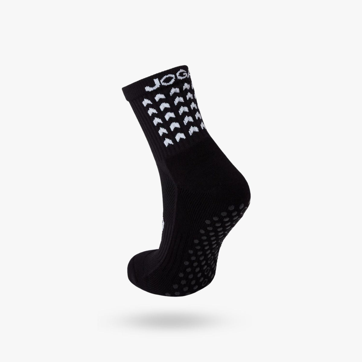 Young athlete wearing JOGA Starz grip socks during training