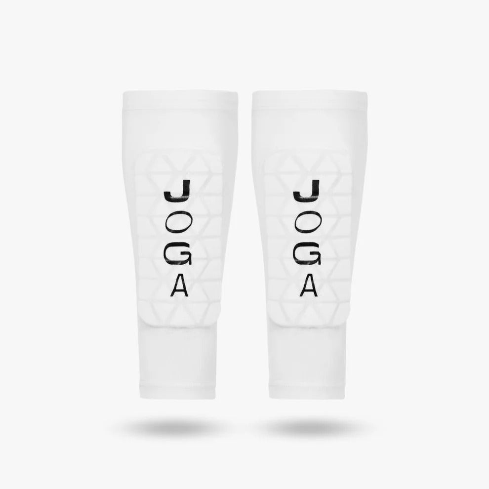 JOGA Shin Pad Sleeve worn on pitch, youth football player in action