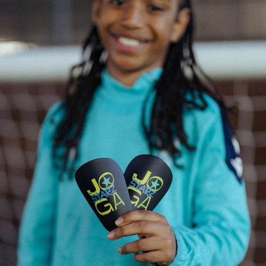 JOGA Starz Shin Pads Midi size, front view on young football player